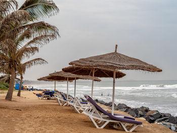 Resting hut on beach against sky