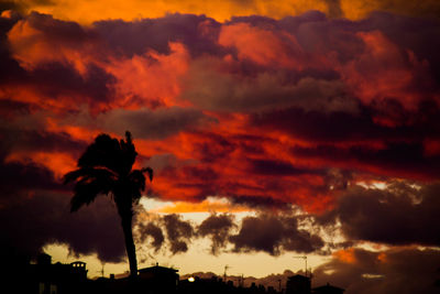 Low angle view of dramatic sky during sunset