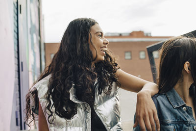 Side view of young woman looking away