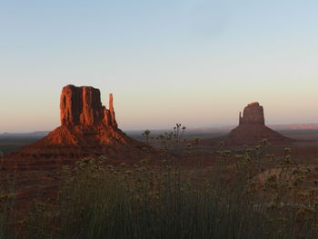 Scenic view of rock formations against sky during sunset