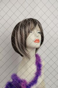 Close-up of mannequin by metal grate