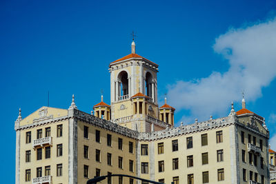 Low angle view of cathedral against blue sky