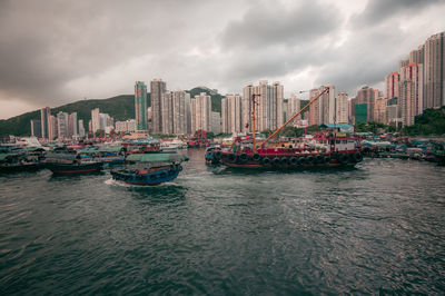 Panoramic view of sea and buildings against sky