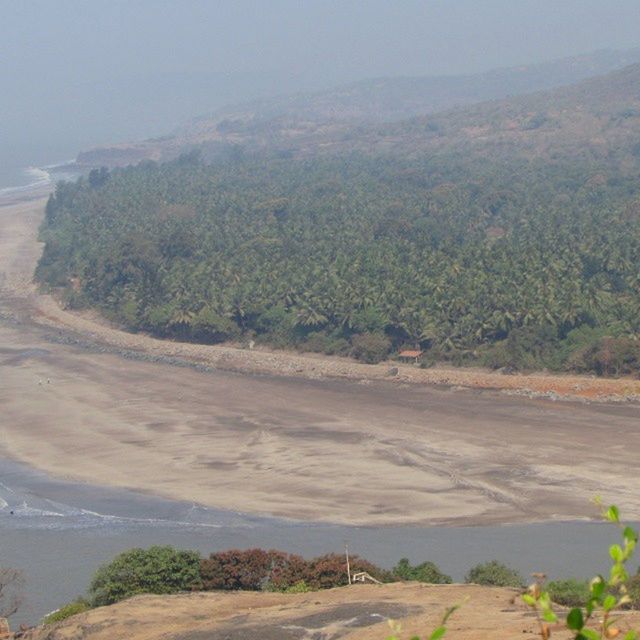 tranquil scene, tranquility, water, scenics, sea, beauty in nature, beach, nature, landscape, mountain, tree, sand, coastline, shore, sky, road, idyllic, high angle view, non-urban scene, day