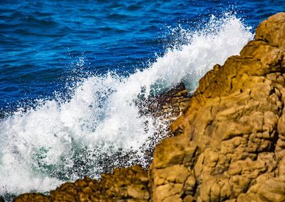 Sea waves splashing on rocks