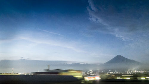 Illuminated car against sky at night