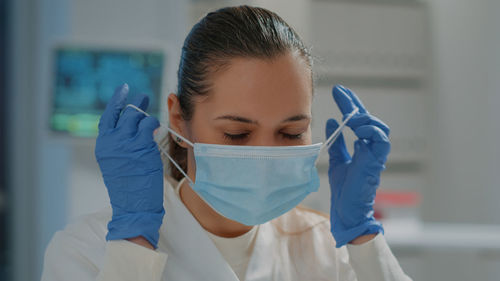 Scientist wearing mask at laboratory