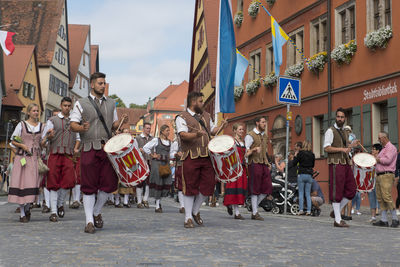 People walking on street in city