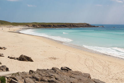 Scenic view of beach against sky