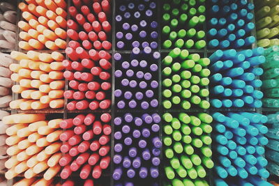 Full frame shot of colorful pens in rack for sale