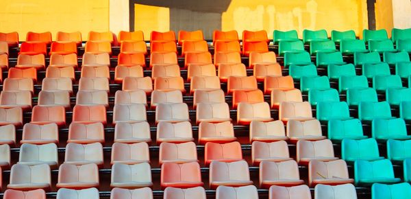 Empty chairs arranged at stadium