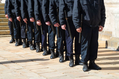 Low section of soldiers standing outdoors