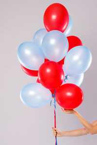 Many colorful balloons isolated on gray background