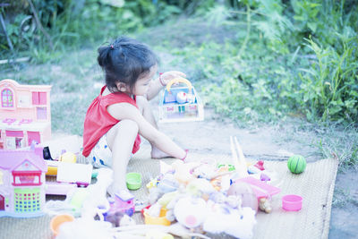 Side view of young woman drinking water