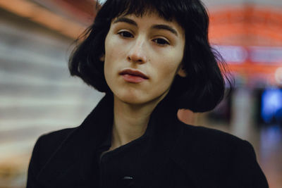 Portrait of young woman in tunnel