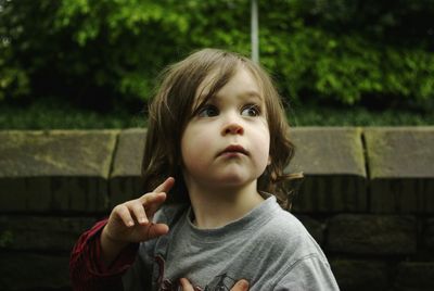 Close-up of cute girl looking away