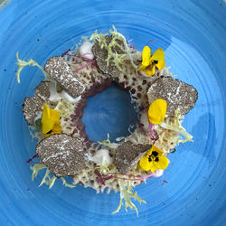 High angle view of various fruits in plate on table