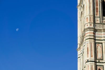 Low angle view of building against blue sky