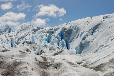 Scenic view of glacier against sky