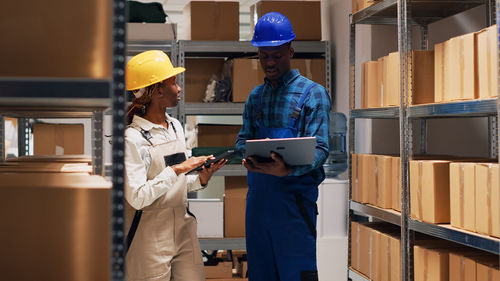 Side view of man working in factory