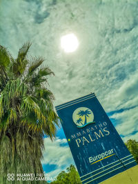 Low angle view of palm tree against sky