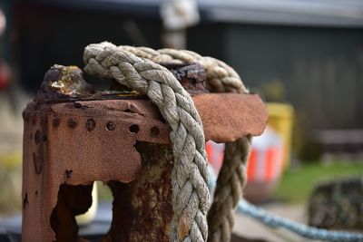 Close-up of rope tied on wooden post