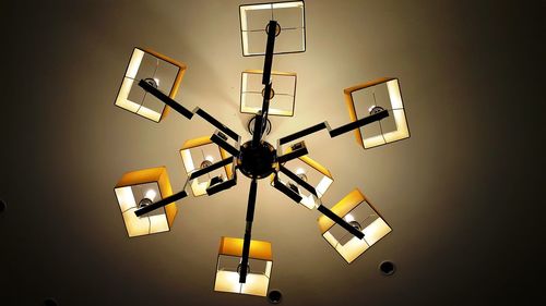 Low angle view of illuminated lighting equipment