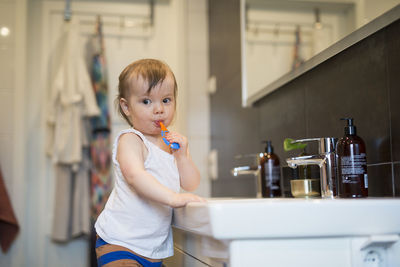 Boy brushing teeth