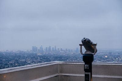 Woman photographing cityscape