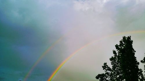 Low angle view of rainbow against sky
