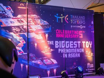 Information sign in illuminated city at night