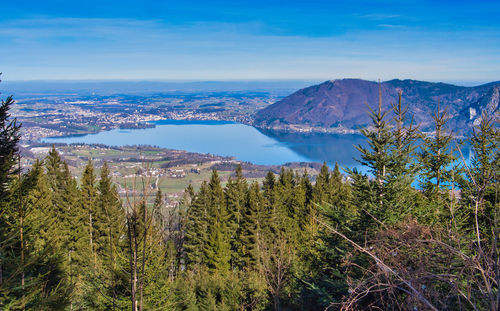 Scenic view of trees and mountains against sky