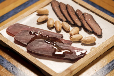 High angle view of chocolate cake on cutting board