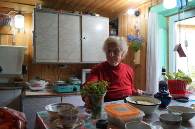 Man preparing food on table in kitchen