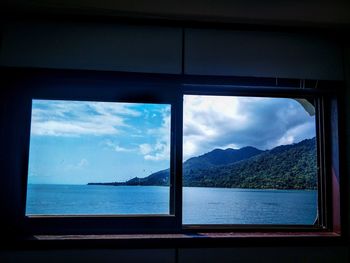 Scenic view of sea seen through window