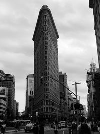 View of city street and buildings against sky