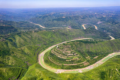 High angle view of farms against sky