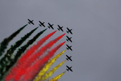 Low angle view of airplane flying against sky