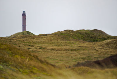 Scenic view of light house on hill 