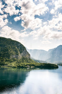 Scenic view of calm lake against mountain range