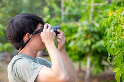 Midsection of man photographing