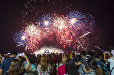 Firework display at night