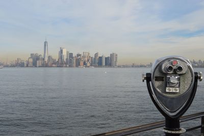 View of modern buildings against cloudy sky