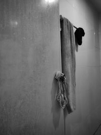 Close-up of faucet hanging on wall at home