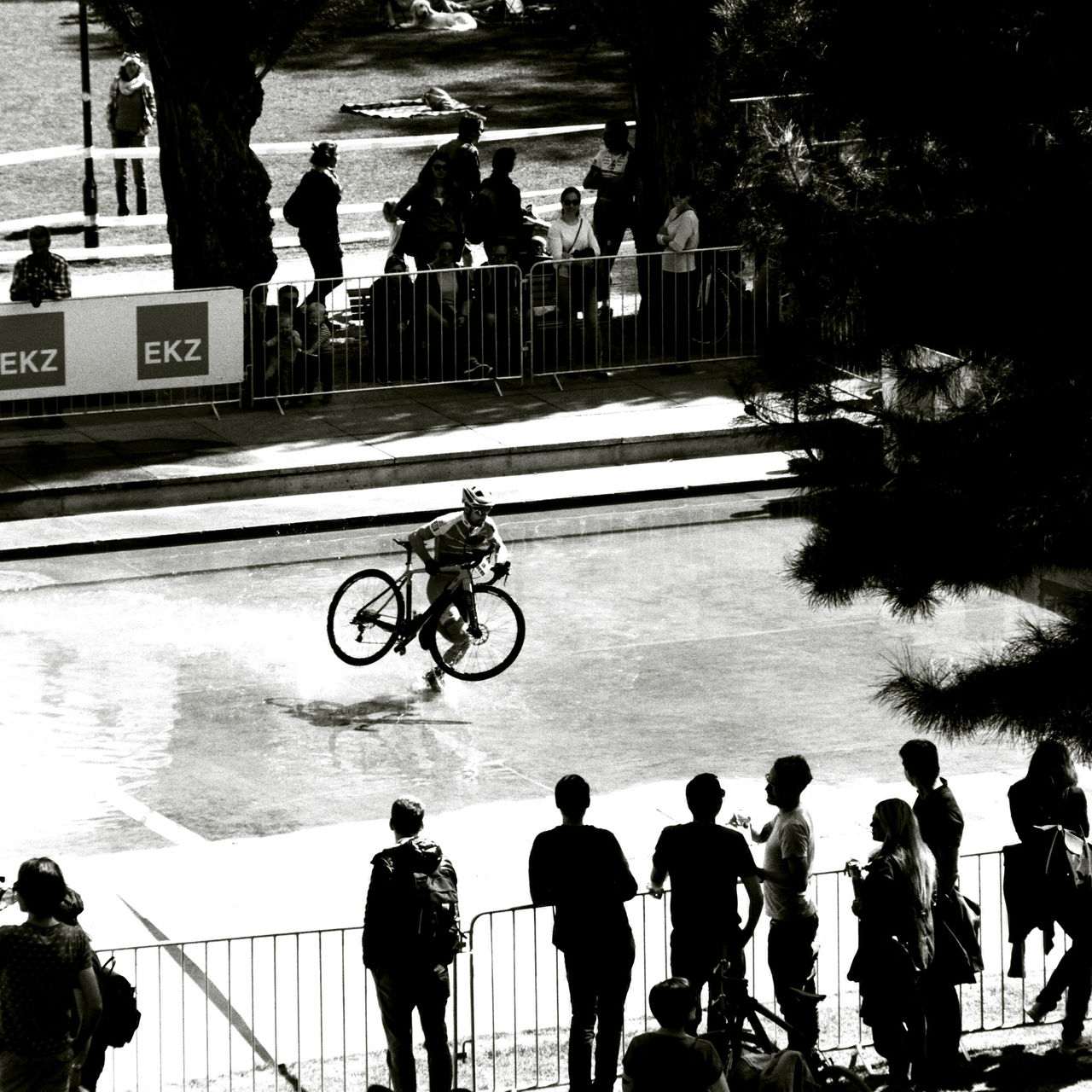 group of people, real people, men, transportation, crowd, large group of people, lifestyles, city, architecture, mode of transportation, leisure activity, women, land vehicle, street, day, bicycle, adult, built structure, group, outdoors, waiting