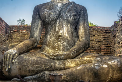 Statue of buddha against sky