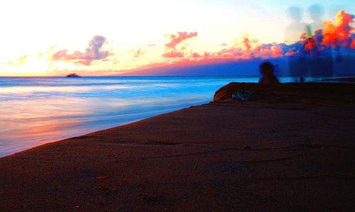 Scenic view of sea at sunset