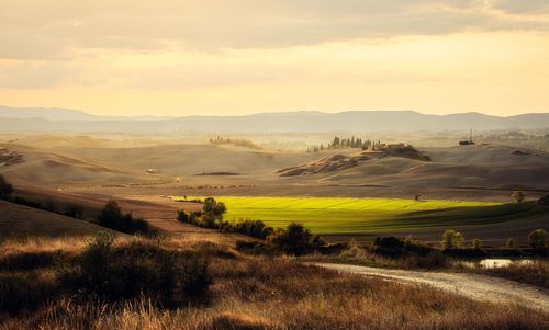 Scenic view of landscape against sky during sunset