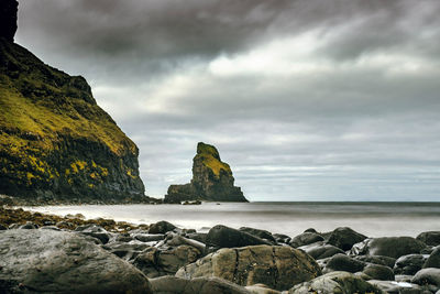 Scenic view of sea against cloudy sky