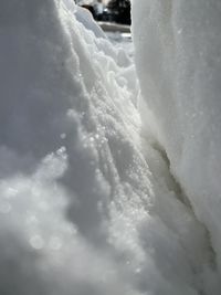 Close-up of snow against sky